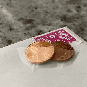 Postage stamp and two pennies