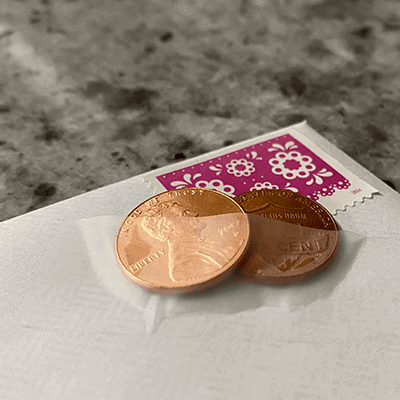 Postage stamp and two pennies