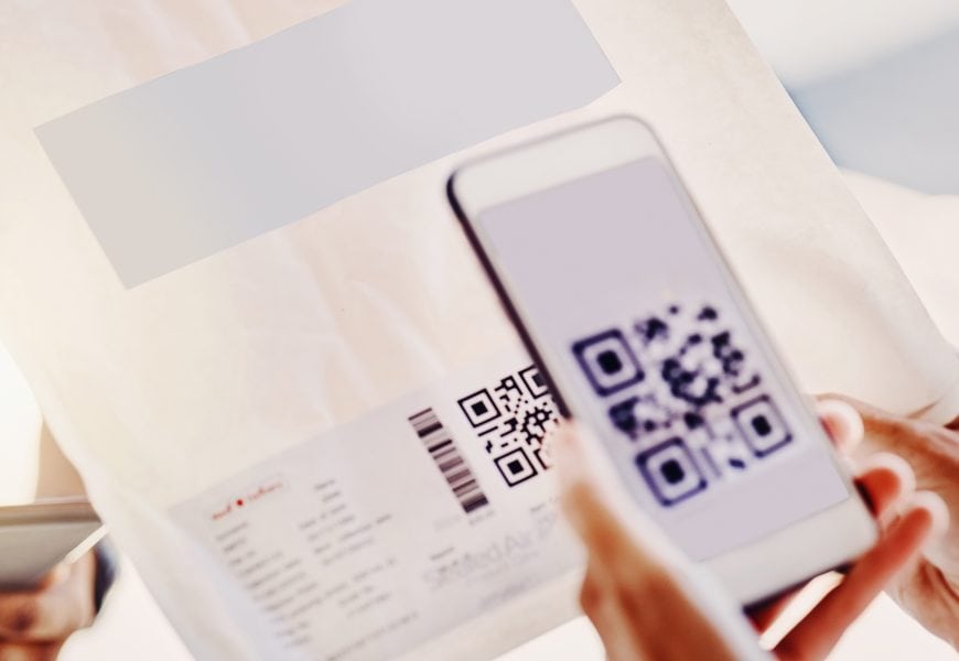 Scan QR code on direct mail piece with smartphone for innovative marketing outreach.