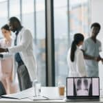 Professional healthcare team discussing medical images in a modern hospital setting.