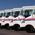 Delivery trucks for direct mail marketing services.