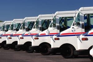 Delivery trucks for direct mail marketing services.