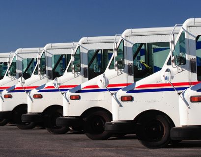 Delivery trucks for direct mail marketing services.