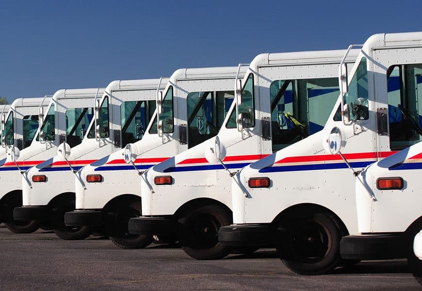 Delivery trucks for direct mail marketing services.